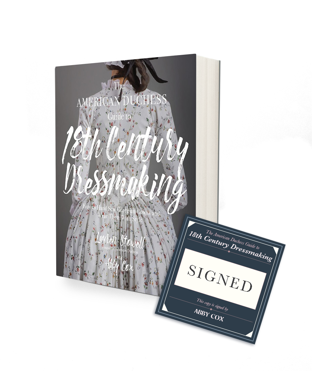 A book with a charcoal gray background and the image of a lady wearing a white bodices dress with a small pink flower pattern appearing to be from the 18th century. The title of the book says The American Duchess Guide to 18th Century Dressmaking. There is a square dark blue bookplate next to the book that indicates it is signed by the author Abby Cox.