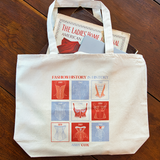 Canvas tote with red and light purple square design on the front. Text says FASHION HISTORY IS HISTORY and then under the design says ABBY COX.