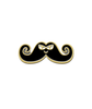 Gold plated enamel pin with black mustache that has an evil face and curly ends.