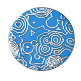 Silver circular pin with light blue enamel with white enamel and silver metal topographic lines.