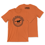 An orange t-shirt that has The Newest Olympian logo on the back neck area and a circular design on the front of a running horse with test that reads "Camp Regular Person; Regular Long Island; Regular New York".