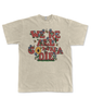 Sand colored tee with illustrated rust colored text, "We're all gonna die" with colorful illustrations of bees, flowers, and a beehive as the 'o' in gonna.