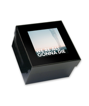 Black gift box with image of movie poster on front.