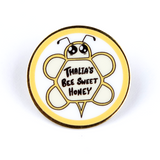 Gold pin with digitally printed geometric bee with large cute eyes and the words Thalia's Bee Sweet Honey on it