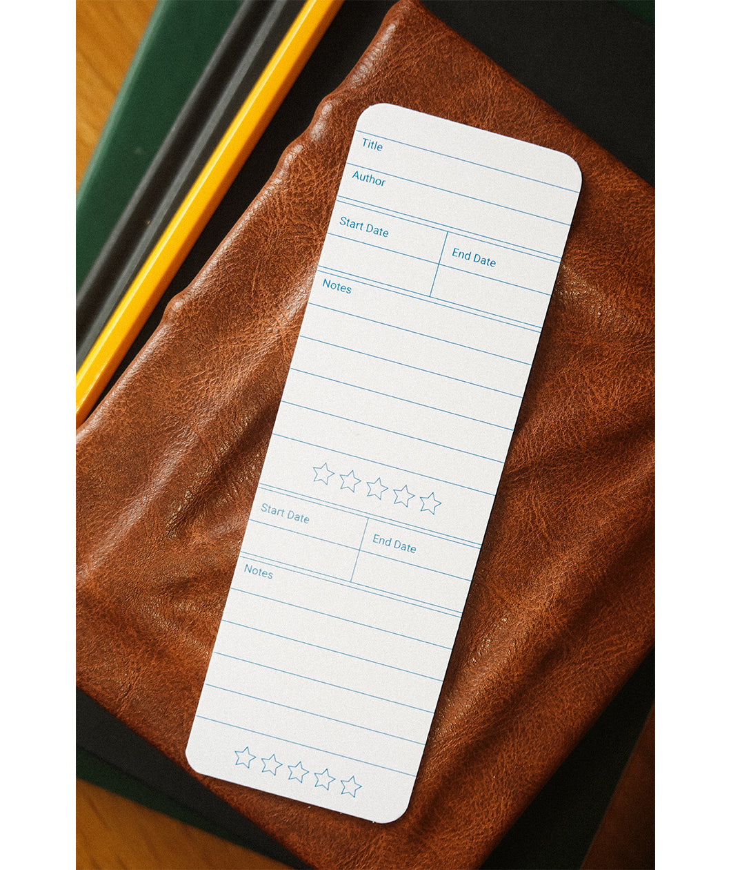 A bookmark with the front design displayed. The design features fields for readers to write about the book being read.
