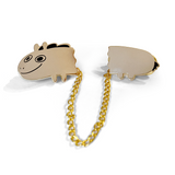 Two pieces of a golden pin that are attached by a gold chain. The front of the pin is the head of Jacob Horse and the other is the back half. From Drawfee.