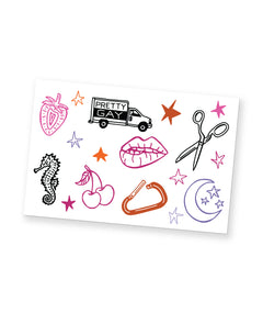 A temporary tattoo sheet that has several illustrations of cute items. Designs include a strawberry, a seahorse, cherries, a carabiner, a moon and stars, lips, a pair of scissors, a truck that says "Pretty Gay", and many stars. From Pretty Gay.