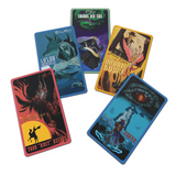 A set of five Outlaws and Obelisks rectangular tradings cards laid out. They are all different colors with different pictures on them.