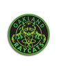 Green and black circular sticker centering a cat with the phrase "Oakland Raycats" around it - by 99% Invisible