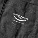 Close-up on a black pocket with the words "Dorian Smiles Inc." over a curved smile and the phrase "Why don't you join me?" in white - by Brian David Gilbert