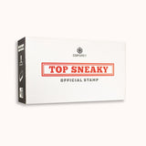 A white box with black sides. CGP Grey logo at the top. Below, "TOP SNEAKY” written in a red serif font surrounded by a red box. “Official Stamp” is written underneath in gray sans serif font. The side has an image of the contents of the box - from CGP Grey.