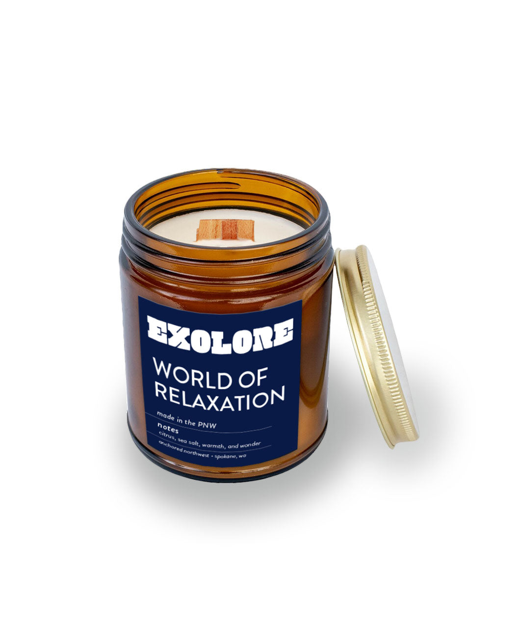 Brown glass candle with wooden wick. Label is dark blue with the words "Exolore" and "World of Relaxation" written below.