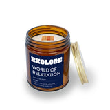 Brown glass candle with wooden wick. Label is dark blue with the words "Exolore" and "World of Relaxation" written below.