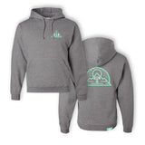 A gray hoodie with a green outline triangle surrounding a green tree. On the left side of the tree is a “G” and on the right is “R” both in white. On the back is a green outline vector drawing of a sun rising above a mountain with a half circle around both. “G” and “R” are in white on either side of a green tree - from the Ginger Runner