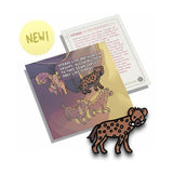 A hyena pin on a pin backing that gives facts about the hyena.