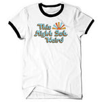 A white short sleeve shirt. The arm and neck holes have black collars. The text “This Might Get Weird” is displayed large across the chest in light blue with multicolored outlines. Next to “This” is a stylized sun with the same colorful rays.