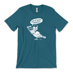 A dark teal t-shirt with a white, illustrated pigeon holding a phone in its mouth, waring headphones with a speech bubble that says "pro-pigeon podcast". From the Newest Olympian.