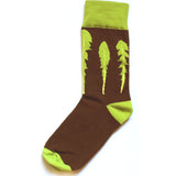 Brown sock with a green ankle, heel, and toe with three green leaves - from This Star Won’t Go Out