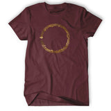 Maroon shirt with a circle of music notes and bars in metallic copper ink in the center of the shirt - from Vi Hart