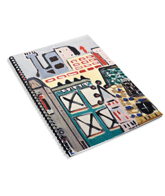 A spiral bound notebook with drawn, colorful buildings on the cover. From Rob Scallon.