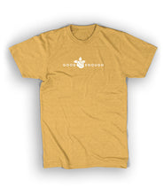 A yellow t-shirt with small caps, white text across the front that reads "Good Enough" with a small rose in the center. From Nathan Zed.
