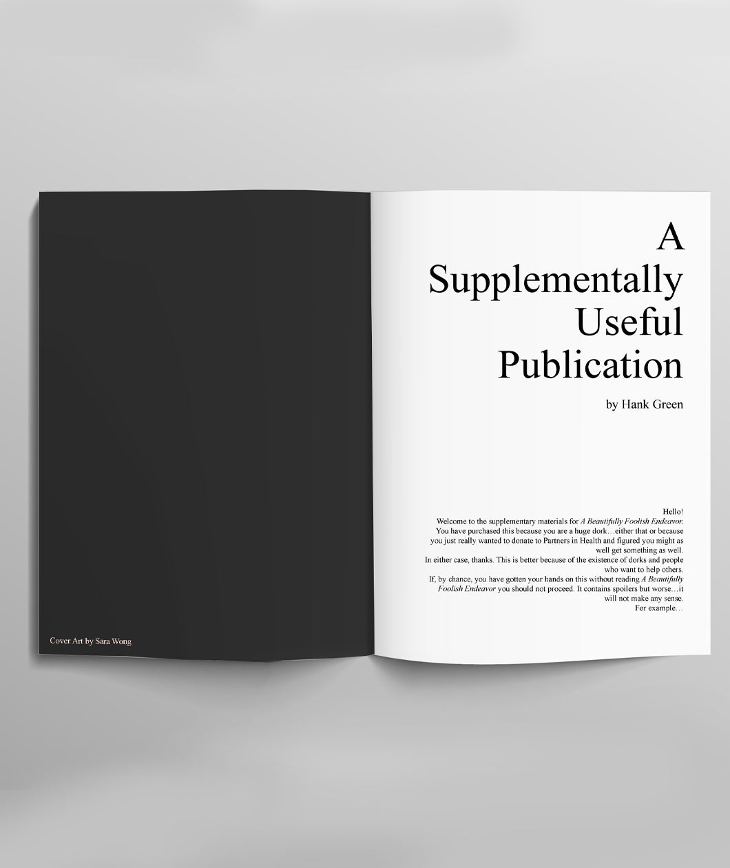 The title spread of the booklet. One black page, and one that has publishing info, including the title A Supplementally Useful Publication by Hank Green.