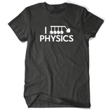 Black shirt with “I” in white sans serif font followed by a vector drawing of Newtons cradle. A heart takes the place of one of the balls. Below, “Physics” is in white sans serif font - from Physics Girl