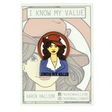 A pin of a woman wearing a suit top and a red hat staring ahead. Black font on the pin reads "I Know My Value". From Karen Hallion.