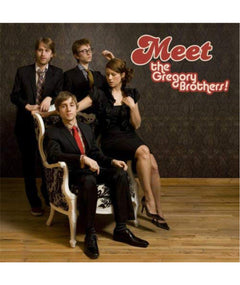 An album cover featuring four people posed in suits and a dress. On the cover it reads "Meet the Gregory Brothers!".