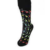 A black sock with spiraling white lines and red, yellow, green, and blue arrows on an axis - from 3Blue1Brown.