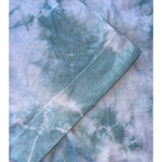 A close up of the blue tie-dye crop top from Sierra Schultzzie, showing the sleeve.