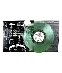 A green vinyl that reads "The Scene is Dead by Rob Scallon". On the left side is a black and white image of a graveyard andon the right is the back of the case featuring lines of small font.