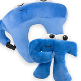 A blue neck pillow in the shape of a pi character and a blue pi shaped plush toy with large oval shaped eyes on the top of his head.