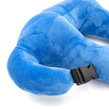 A closeup of a blue neck pillow in the shape of a pi character. The pillow is blue, and the closeup shows a clip from the pi character's arm that connects to the body. From 3Blue1Brown.