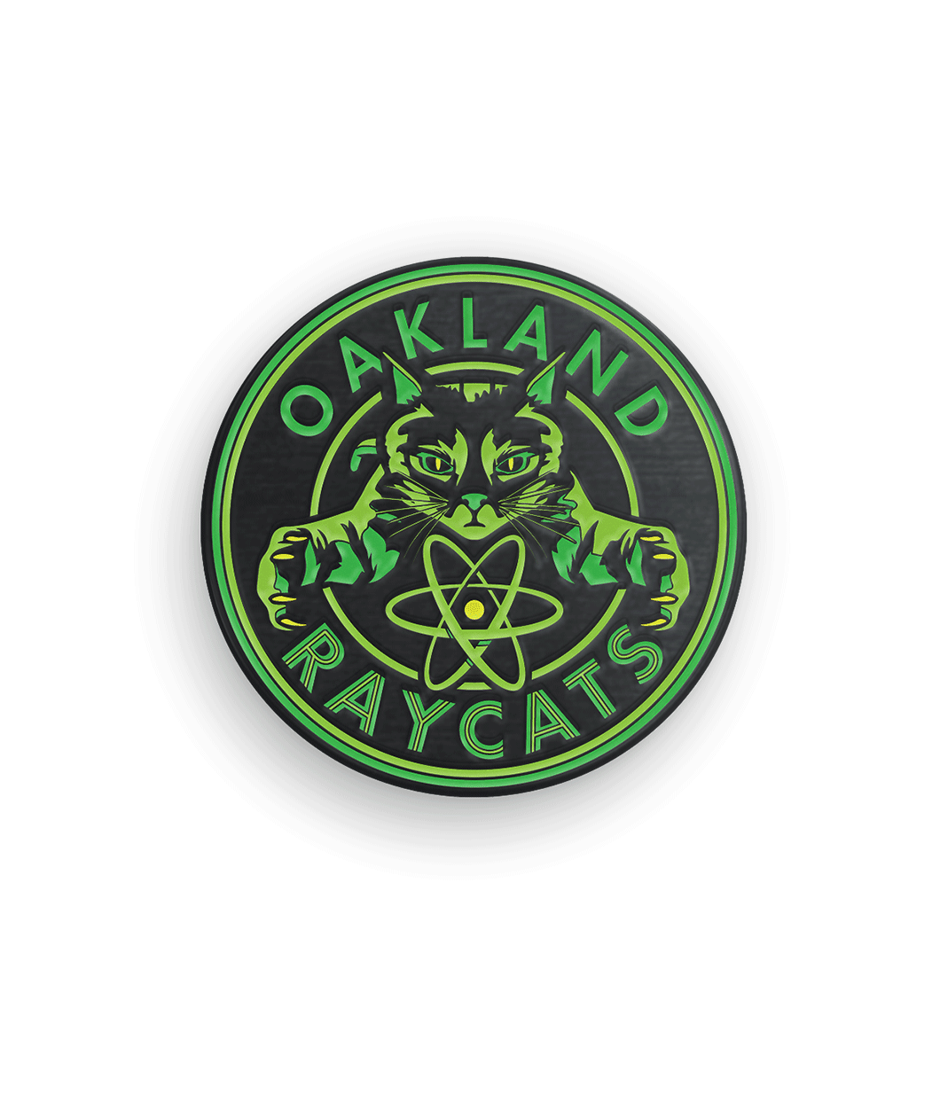 Green and black circular pin centering a cat with the phrase 
