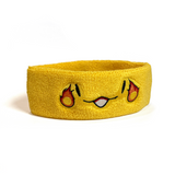 A yellow sweatband with a smiling face that has a fireball on the side of each eye.