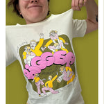 Izzy modeling the Izzy & Brennan's Shenanigans shirt against a green background.