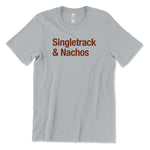 A silver/gray t-shirt with maroon lettering across the front that reads "Singletrack & Nachos". From Courtney Dauwalter.