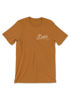 Caramel colored t-shirt with a logo on the heart that says DFTBA don't forget to be awesome. There is an illustrated cowboy hat on the acronym text which also looks like it is a rope.