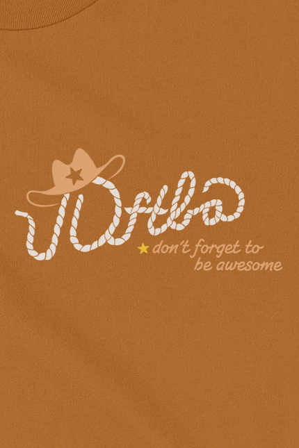 Cream text that says 'Dftba' and looks like a rope. The 'D' has a cowboy hat on top with a star. Underneath the 'f' and 't' is is a little yellow star and brown text next to it that says, "don't forget to be awesome"