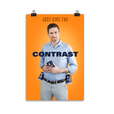 Poster of a man holding the Mornton's salt container. Text above him says, " JUST GIVE THE" and text overlayed says, "CONTRAST". Poster background is orange.