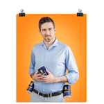 Photo of a man smirking at the camera with Morton's salt containers strapped to his belt on either side. He holds a third container of Morton's salt in his hands at his stomach. On an orange background.