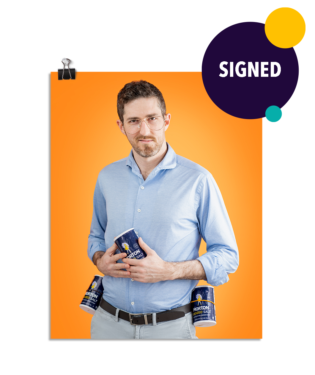 Photo of a man smirking at the camera with Morton's salt containers strapped to his belt on either side. He holds a third container of Morton's salt in his hands at his stomach. On an orange background. This print is signed by the doctor!