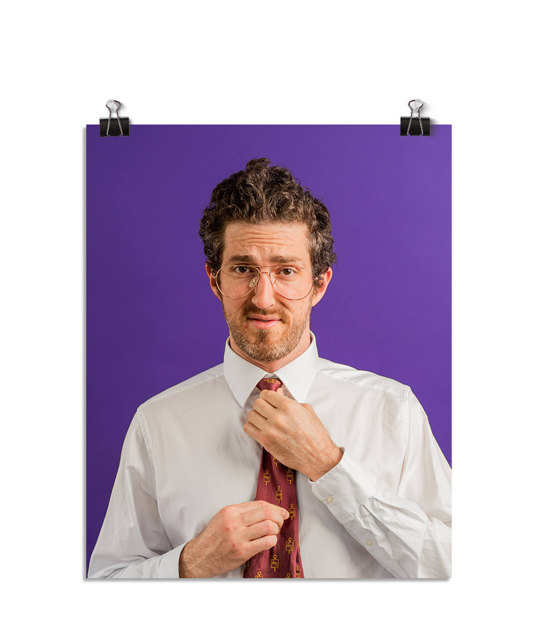 Photo of a man with aviator shaped glasses fixing his red tie and looking at the camera like he is a know it all. On a purple background.