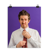 Photo of a man with aviator shaped glasses fixing his red tie and looking at the camera like he is a know it all. On a purple background.