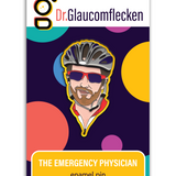 Enamel pin with black metal plating that has the bust of a man with a bike helmet and sunglasses looking at you on a yellow background. Backing card is purple with colorful dots with the text at the top reading, "Dr. Glaucomflecken" and text on the bottom noting, "THE EMERGENCY PHYSICIAN enamel pin"