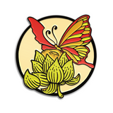 1.25" Soft Enamel Pin with black metal plating. Design of a butterfly with red, orange, and lime green wings sitting on an orange moon that is peaking out of a lime green hops plant. The background is a cream colored circle with the black metal plated border.