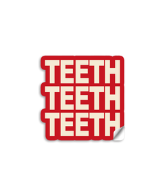 3" vinyl die cut sticker with bold block text. A red sticker with off white text says "TEETH TEETH TEETH".