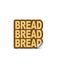 3" vinyl die cut sticker with bold block text. A Brown sticker with yellow-tan text says "BREAD BREAD BREAD". 