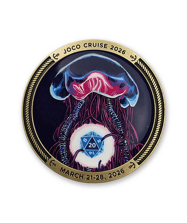 Circular gold coin with a colorful jellyfish design. Text of the top is engraved, "JOCO CRUISE 2026" and text on the bottom says "MARCH 21-28, 2026"